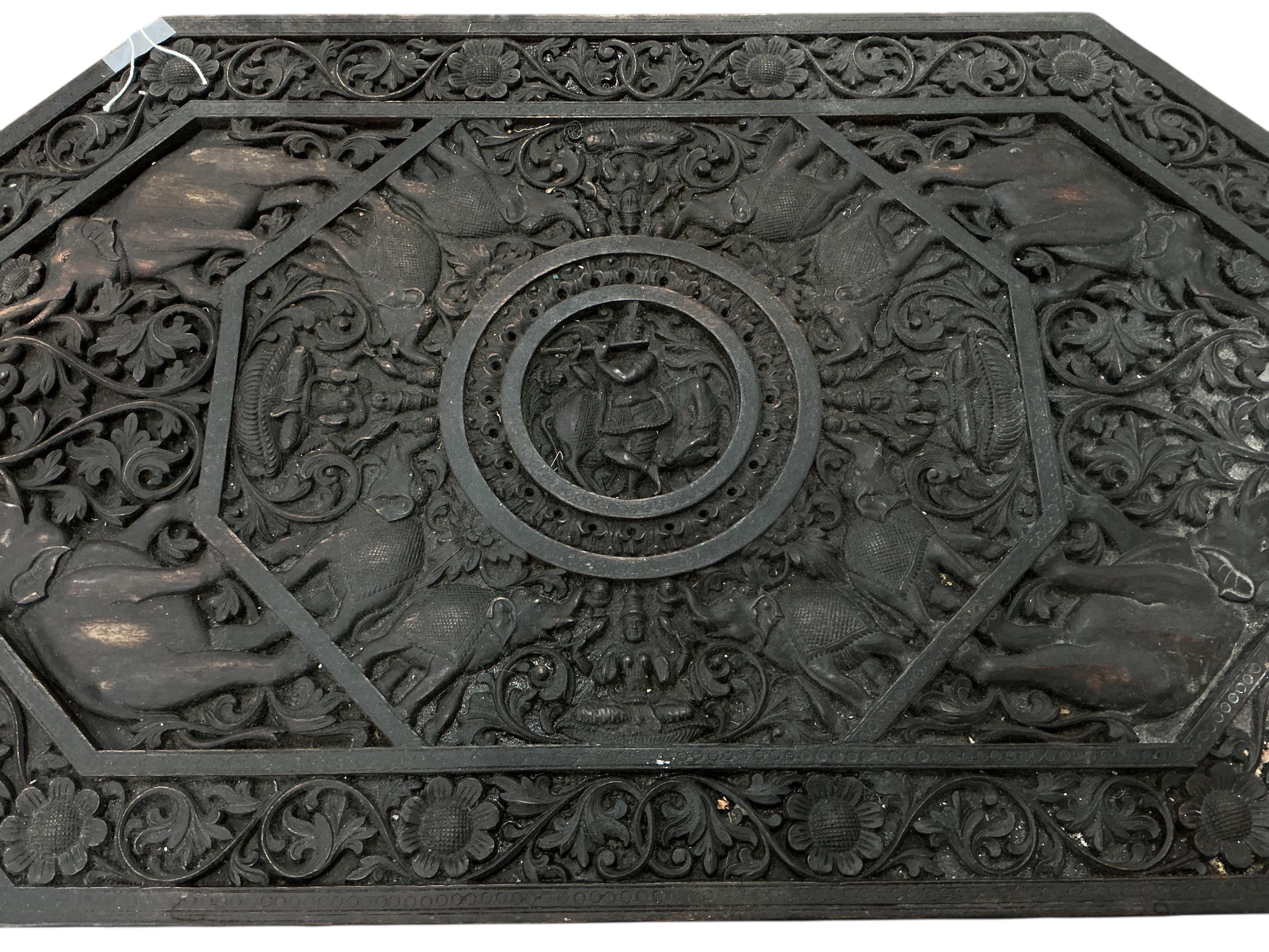 An Indian octagonal carved hardwood occasional table, width 91cm, depth 54cm, height 61cm